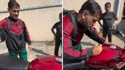 ‘Chala ke report dena’: MS Dhoni signs fan’s bike, video goes viral – watch | Cricket News