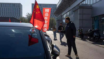 High-end car sales sink in China as its economy slows, taking a toll on European automakers