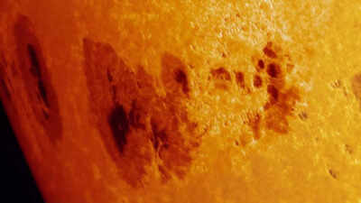 Why did a minor sunspot erupt while a huge one rotated toward Earth’s side |