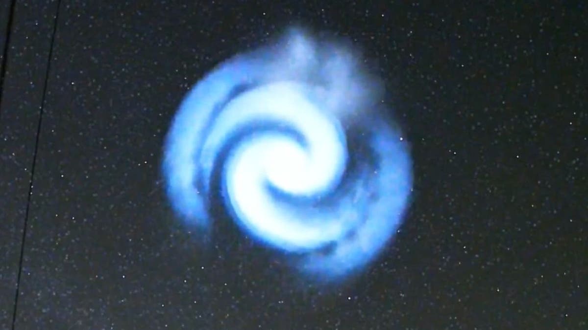 Spectacular blue spiral light from Space X rocket captured on video