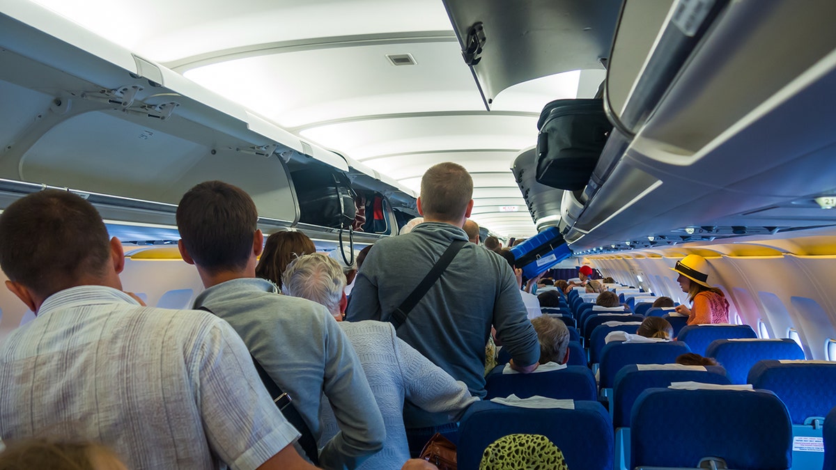 Plane etiquette expert warns against standing immediately after landing